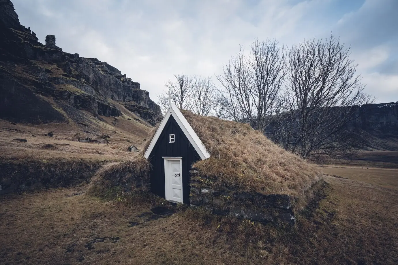 Close-up view of a beautiful turf house in a grassy valley in Iceland.